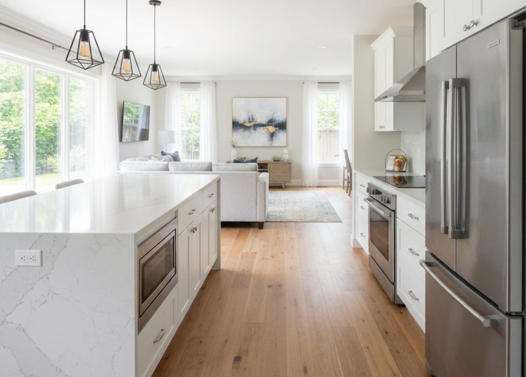 Open-concept kitchen, living, and dining in a whole-home remodel